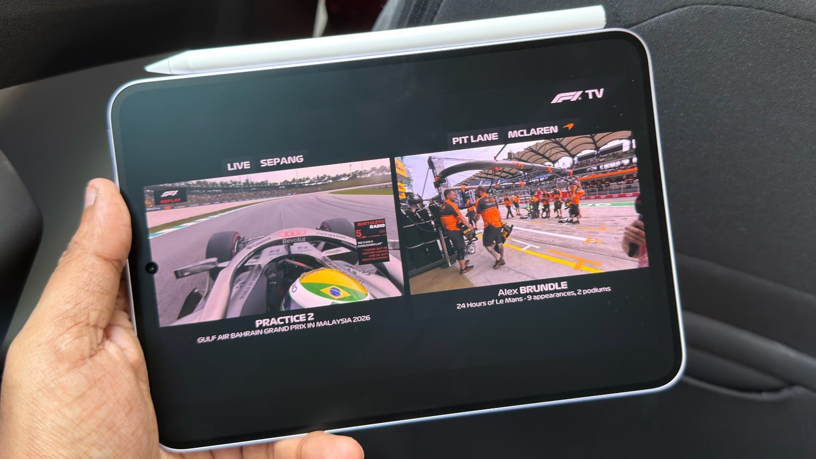 Oppo Pad mini in hand playing an F1 race stream