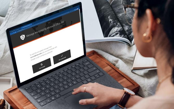 Laptop showing a message Encrypted by Microsoft Office 365 screenshot showing the option to authenticate with Google or receive a temporary passcode.