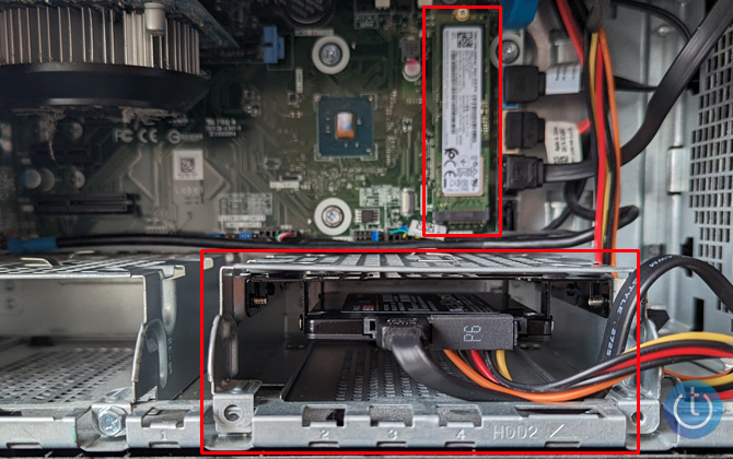 Samsung NVMe M.2 drive installed in the upper right (in a red box). A Samsung SATA SSD is installed in a bay in the lower right (in a red box).