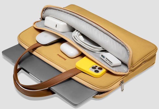 tomtoc H21 Series showing the pockets open with accessories and a laptop inside