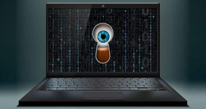 Computer hacking concept that shows a screen with a keyhole surrounded by ones and zeros with an eye looking through the keyhole.