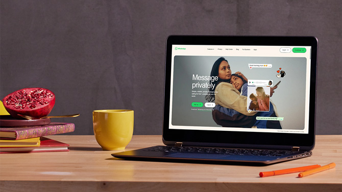 Home page for the WhatsApp Web Login shown on a laptop