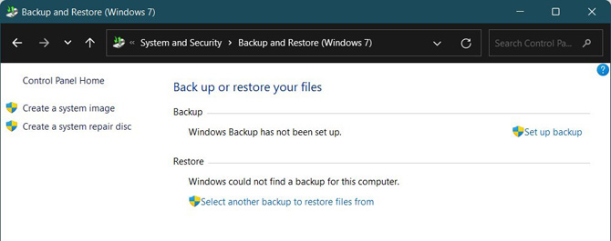 Windows Control Panel System and Security Back up and Restore (Windows 7) window. You see the options for Create a system image and create a system repair disc on the right column. In the main column you see Back up or restore your files,