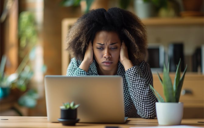 Concept drawing of woman looking at her computer with frustration.