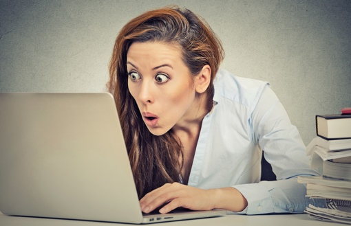 Woman shocked at computer