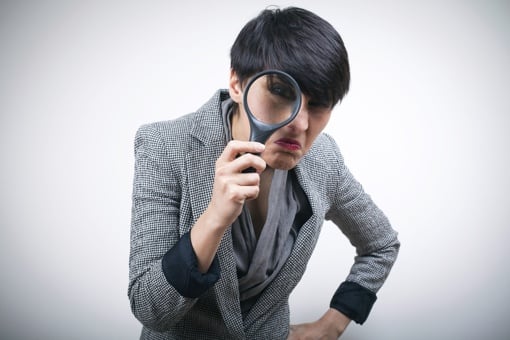 Woman with magnifying glass