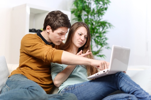 Worried couple using a computer