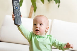 Baby holding remote