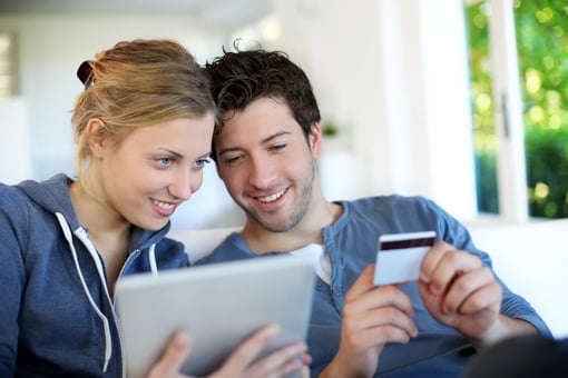 Couple making a purchase online with a tablet