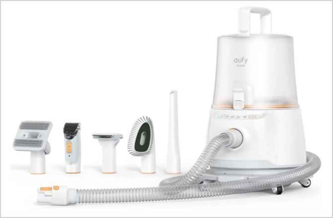 eufy N930 Pet Grooming Kit with Vacuum. Attachments from the left are the Grooming Brush, Trimmer, De-shedding Brush, Cleaning Brush, and Nozzle.