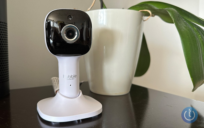 Hubble Connected Nursery Pal Cloud camera next to an orchid for scale