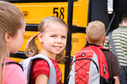 Kids getting on school bus