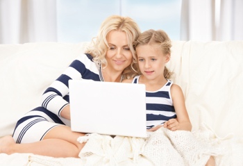 Mom and daughter using a laptop
