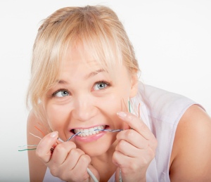 Woman biting wires