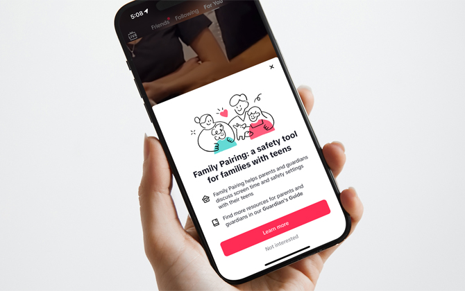 Phone showing the Family Pairing safety tool screen encouraging you to find out more.