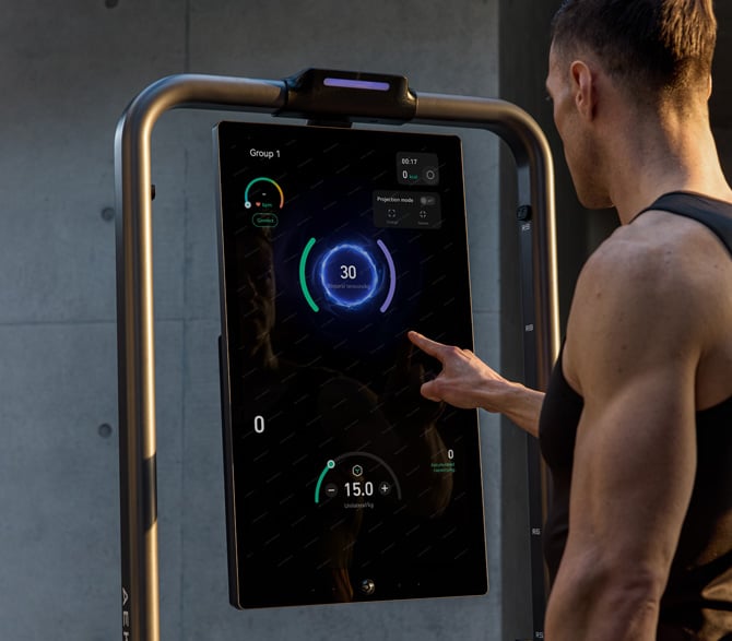 Man using large touch screen display to see workout settings on AEKE S1 Pro