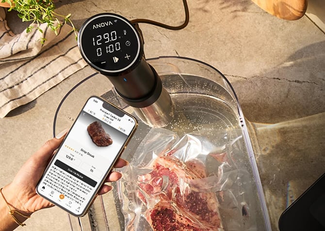 Anova Precision Cooker 3.0 is shown cooking a steak and you can see the Anova app with a steak recipe.