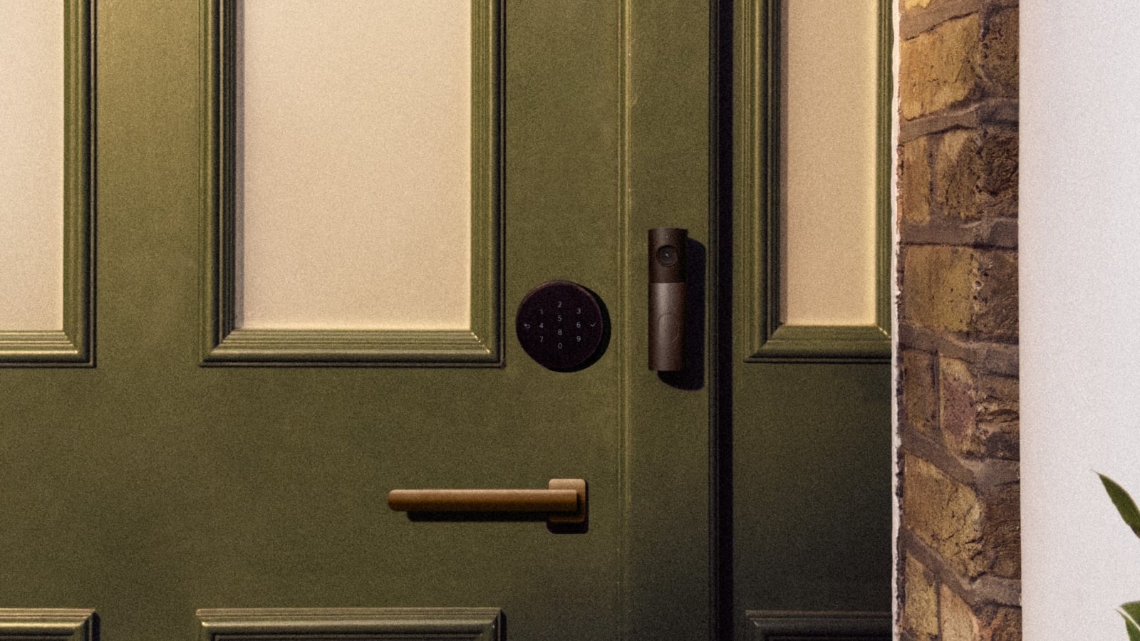 Apple smart lock installed on a green door