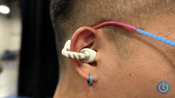 Cearvol Liberte hearing aid worn on ear and shown from the side