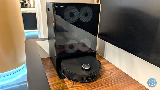Dreame Matrix10 Ultra is shown from the front with the robotic vac docked and three sets of mop pads visible.