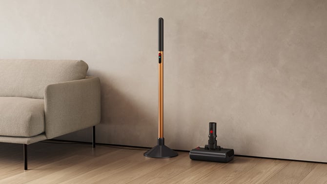 The Dyson PencilWash is shown with the stick charging and the head in its stand