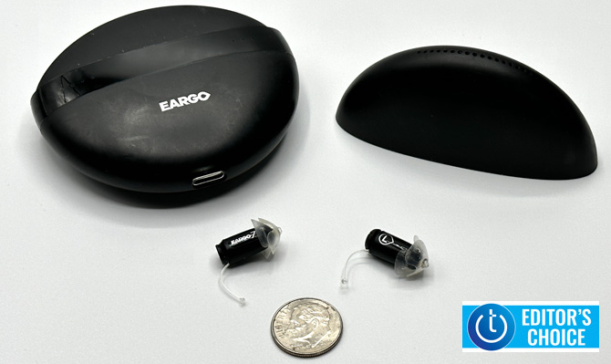 Eargo 7 shown outside of the case and a dime for scale. The Techlicious Editor's Choice award logo is in the lower right corner.