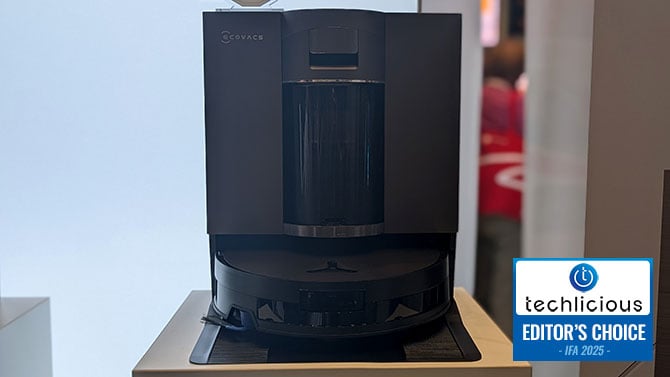 ECOVACS DEEBOT X11 OMNICYCLONE Robotic Mopvac in its charging station. The Techlicious Editor's Choice Award logo is in the lower right. 