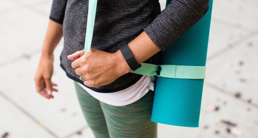 Fitbit Charge worn on a woman's wrist