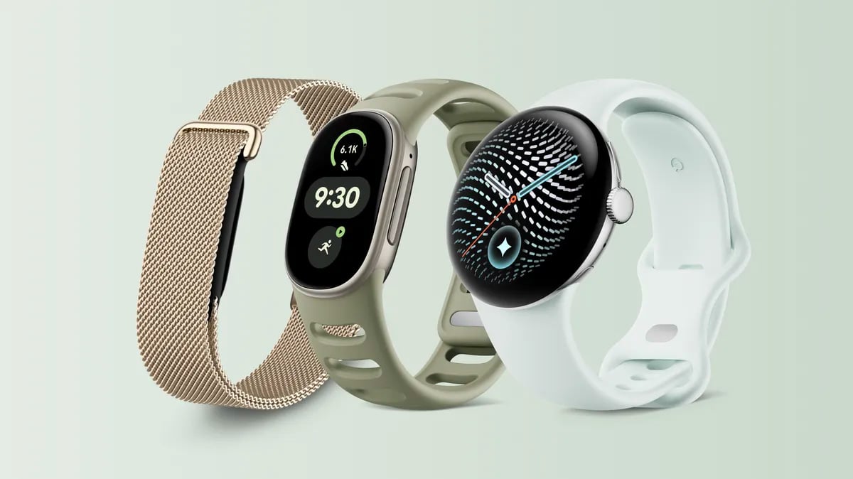 Google wearables from the left: Fitbit Air with a gold mesh band, Fitbit Edge with a sage green band, and Pixel Watch 5 with a pale blue band.