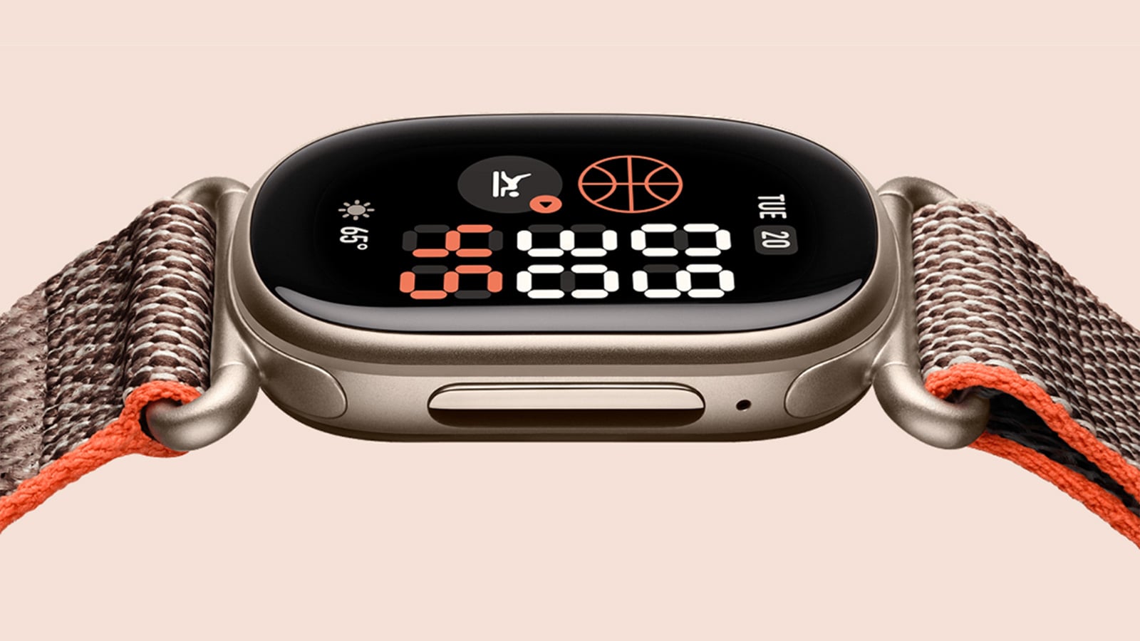 Close-up of a Google Fitbit Edge Stephen Curry Edition with a bronze-colored case, woven brown band with orange trim, and basketball-themed watch face.