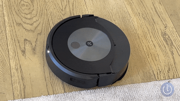 iRobot Roomba Combo j7+ lifting away the mop and transitioning from wood floor to carpet.
