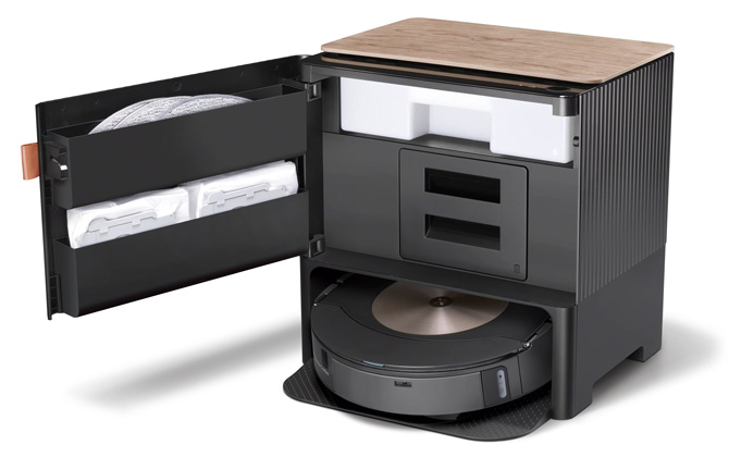 iRobot Roomba Comb o j9+ base open and showing storage for additional mop pads. The mopvac is docked in the base.