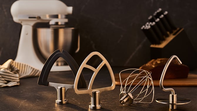 KitchenAid Artsan Plus attachments from the left: double flex edge beater, flat beater, wire whisk, and dough hook.