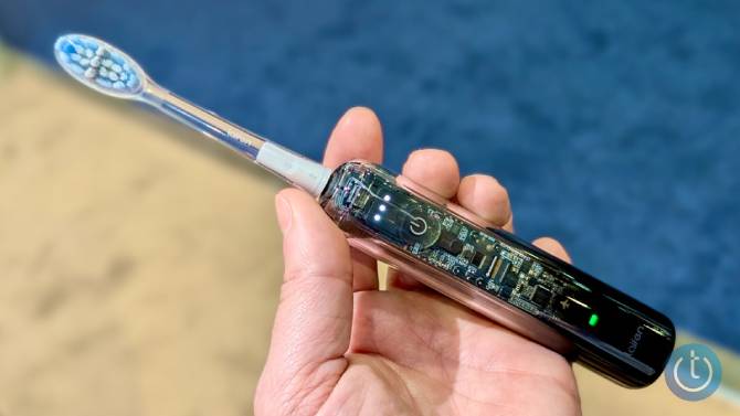 A hand holding the laifen wave pro electric toothbrush at ces