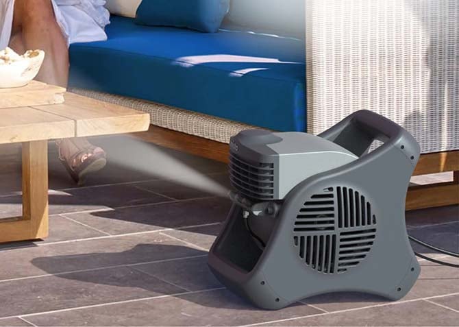 Lasko Misto Outdoor Misting Blower Fan blows visible mist.