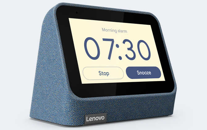 Lenovo Smart Clock 2 in blue with alarm set up on the display on a gray background.
