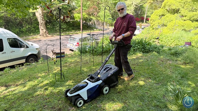 Litheli EASYSURGE 18.5-inch lawn mower is shown from the front three-quarter angle view with John Siemiarowski .