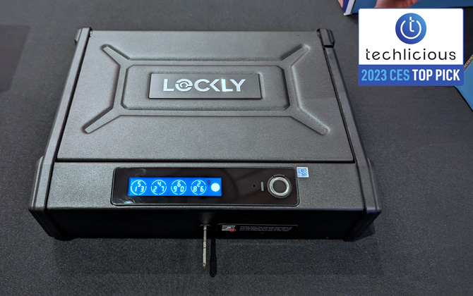 Lockly Smart Safe with key on table. The pin code interface is visible on the lower left and the fingerpint scanner on the right.
