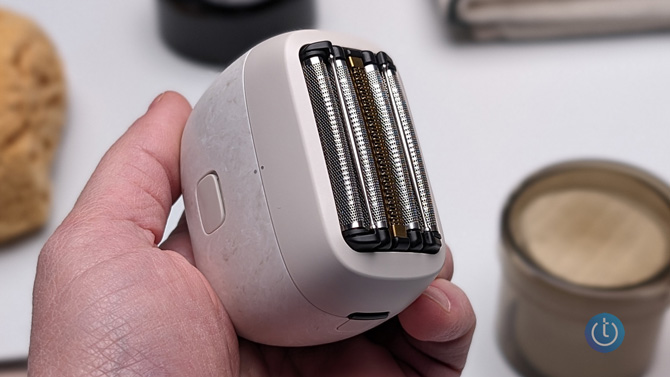 Panasonic Palm Shaver shown easily fitting in the palm of your hand