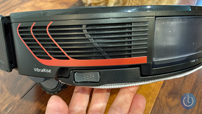 Roborock S7 MaxV Ultra shown from the side with the Vibrarise logo. A  hand is supporting the robo mopvac. 