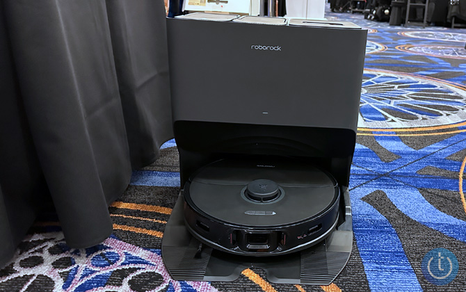 Roborock S8 Pro Ultra in its dock on a carpet.