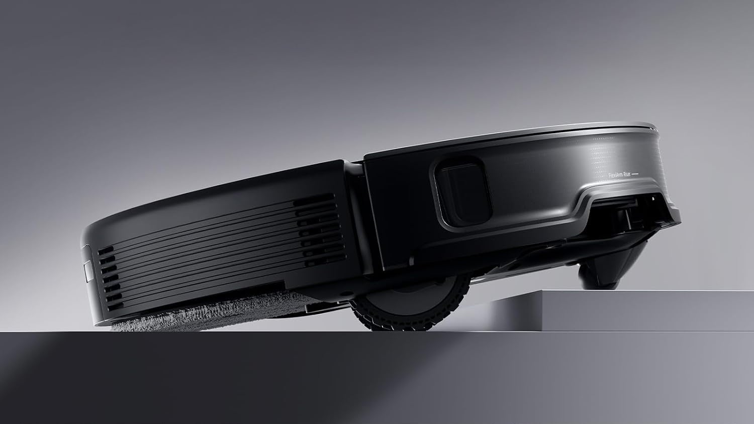 Side view of a Roborock Saros R10 robot vacuum lifting its body to cross a raised threshold.