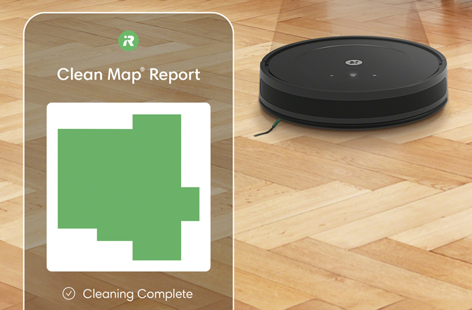 The iRobot Roomba Combo Essential is displayed on a floor with a screenshot of the iRobot Home app on the left, showing a map of the cleaned areas