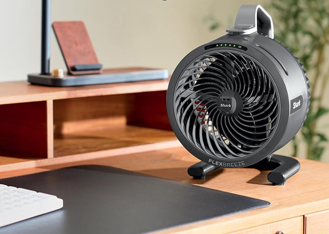 The Shark FlexBreeze HydroGo Pro Fan is sitting on a desk for scale.