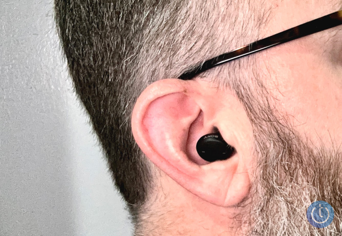 Sony CRE-E10 OTC hearing aid shown in ear from the side.