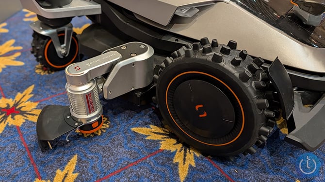 Sunseeker cutting arm mounted on the side of the mower