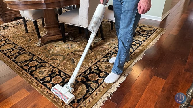 The SwitchBot K10+ Pro Combo stick vac shown vacuuming carpet