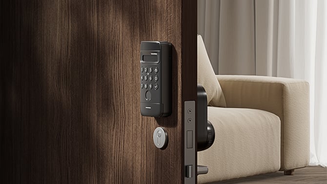 Closeup of the SwitchBot Lock Ultra Vision Combo showing the exterior Vision keypad on the outside and Ultra Lock from the back and side on the interior of the door. 