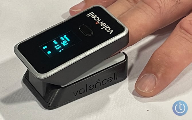 Valencell blood pressure monitor on fingertip.