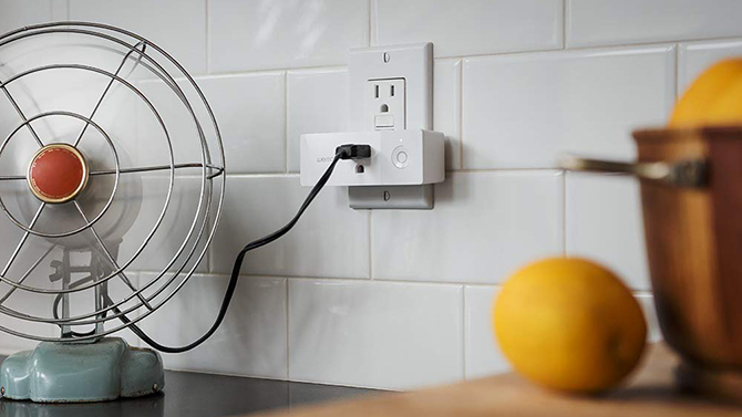 Belking Wemo Mini Smart Plug with a fan plugged in.